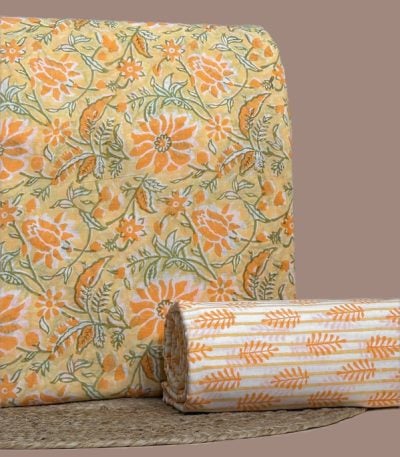 This 2pc unstitched fabric set includes a Blockprinted Soft Cotton top and matching bottom fabric in a orange floral with a coordinating stripe-floral design. Soft