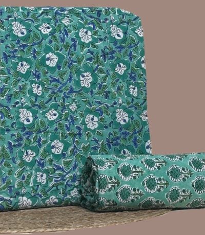 This 2pc unstitched fabric set includes a Blockprinted Soft Cotton top and matching bottom fabric in a white floral vine with a coordinating floral bud motif design. Soft