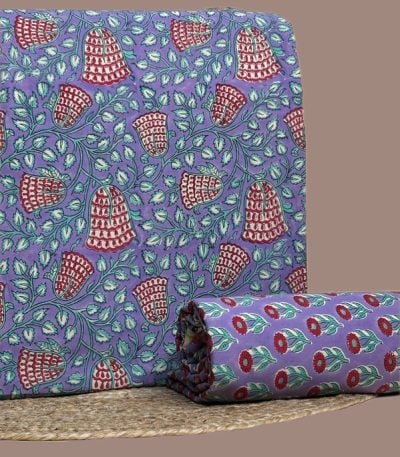 This 2pc unstitched fabric set includes a Blockprinted Soft Cotton top and matching bottom fabric in a bell-shaped floral with a coordinating floral print design. Soft