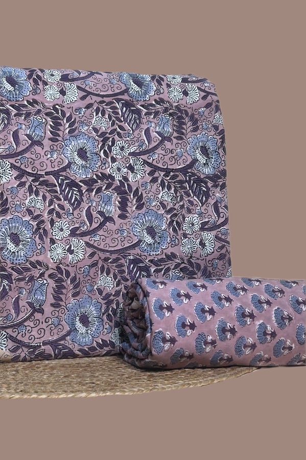 This 2pc unstitched fabric set includes a Blockprinted Soft Cotton top and matching bottom fabric in a bird and paisley floral with a coordinating fan motif design. Soft