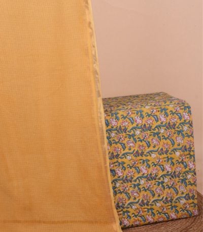 This 2pc unstitched fabric set features a soft