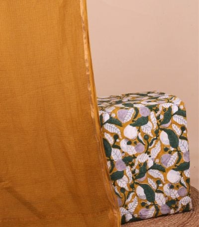 This 2pc unstitched fabric set features a soft