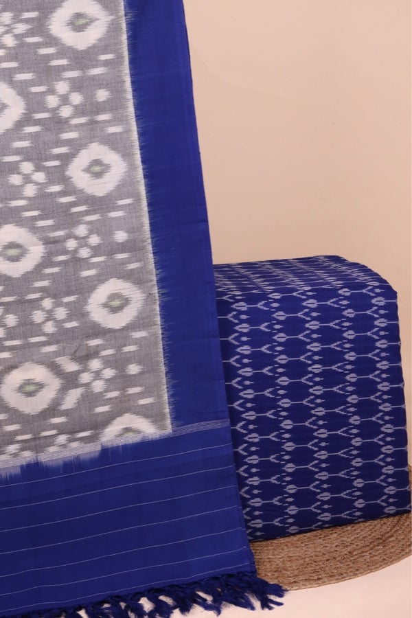 This 2pc unstitched fabric set features an Ikkat-weave dupatta with a woven border and tasseled fringe