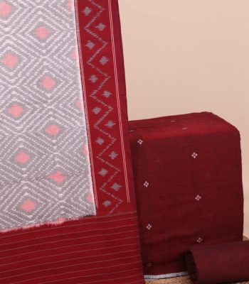 This 3pc unstitched fabric set features an Ikkat-weave dupatta with a woven border and tasseled fringe