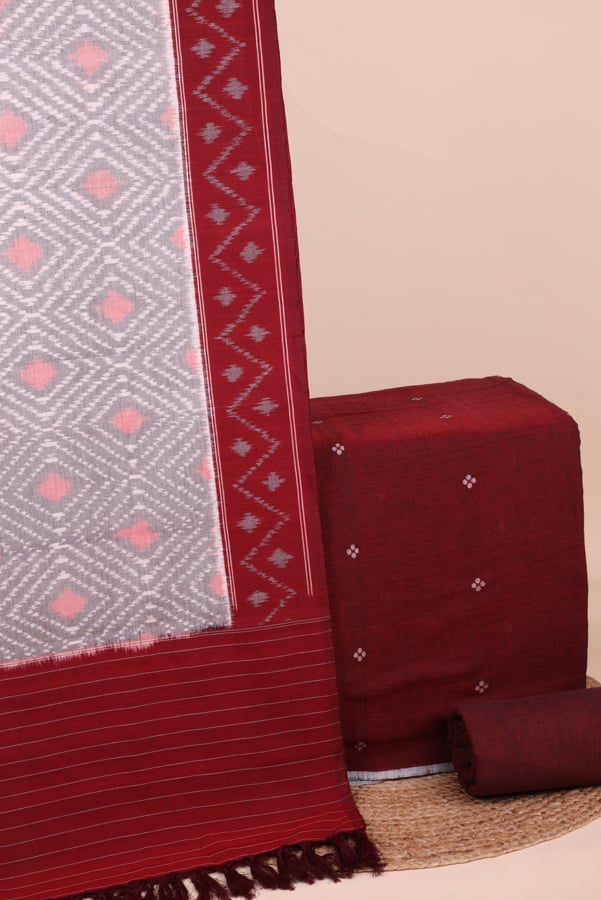 Red - 3pc Ikkat Dupatta with Ikkat Top & Plain Handloom Cotton Bottom Set This 3pc unstitched fabric set features an Ikkat-weave dupatta with a woven border and tasseled fringe