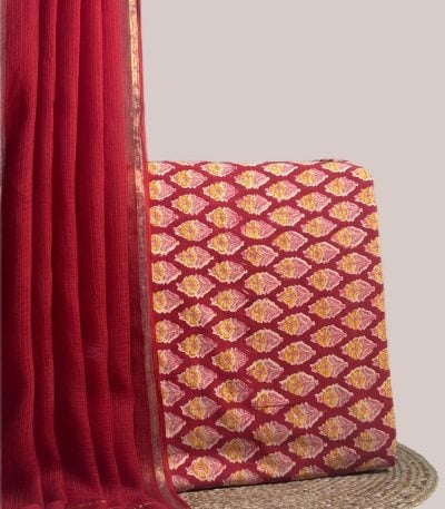 This red unstitched suit fabric set includes a 2.50 metre AirLoom™ Kota dupatta paired with a 2.50 metre Blockprint Soft Cotton top fabric. Ideal for custom tailoring into your preferred silhouette.