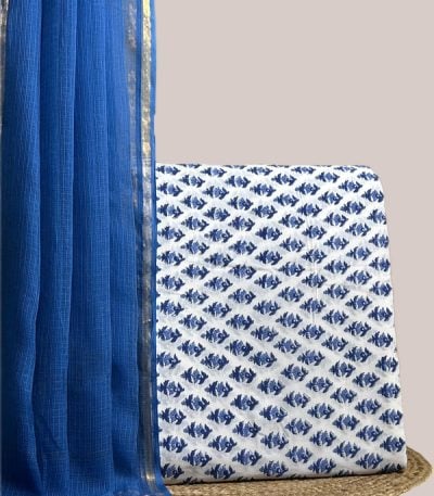 This blue unstitched suit fabric set includes a 2.50 metre AirLoom™ Kota dupatta paired with a 2.50 metre Blockprint Soft Cotton top fabric. Ideal for custom tailoring into your preferred silhouette. [Internal note: Top is white base with blue fish-motif print; colour taken as Blue per top-wins convention - please confirm.]