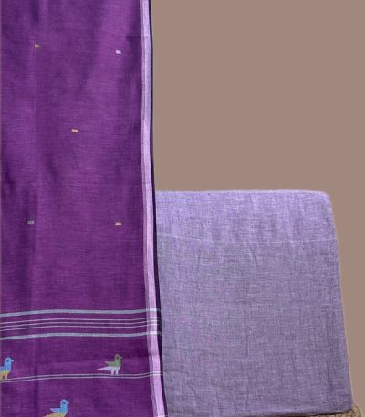 This purple unstitched suit fabric set includes a 2.50 metre Handloom Cotton dupatta paired with a 2.50 metre Handloom Cotton top fabric. Ideal for custom tailoring into your preferred silhouette.