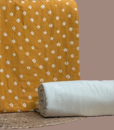 This yellow unstitched fabric set includes a 2.50 metre Bandhani Cotton top and a 2.50 metre Handloom Cotton bottom. No dupatta included in this set.