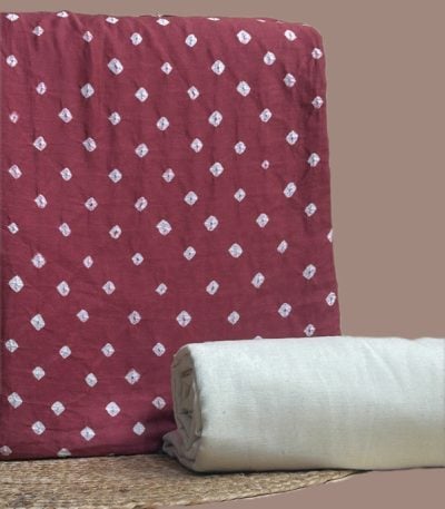 This red unstitched fabric set includes a 2.50 metre Bandhani Cotton top and a 2.50 metre Handloom Cotton bottom. No dupatta included in this set.