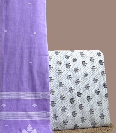 This purple unstitched suit fabric set includes a 2.50 metre Handloom Cotton dupatta paired with a 2.50 metre Blockprint Soft Cotton top fabric. Ideal for custom tailoring into your preferred silhouette.