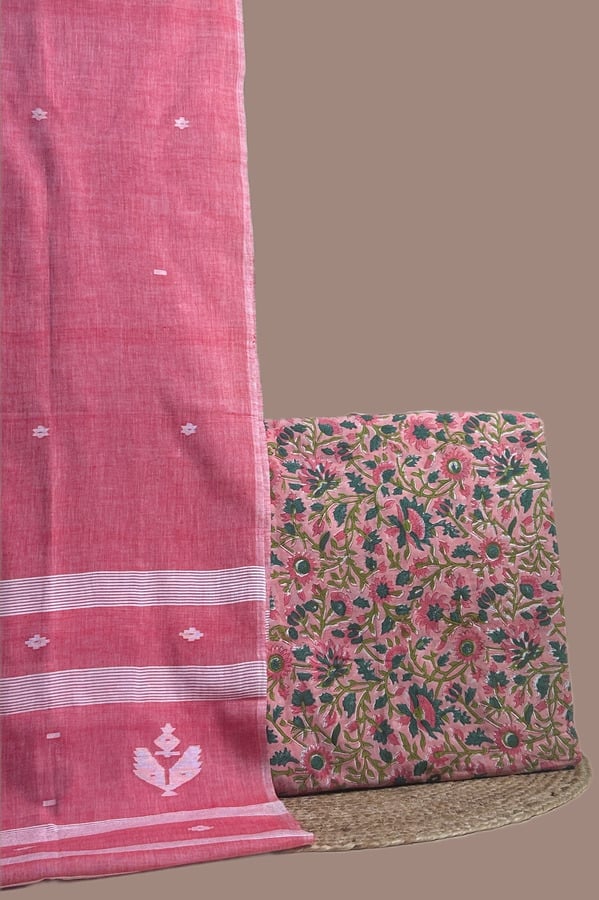 This pink unstitched suit fabric set includes a 2.50 metre Handloom Cotton dupatta paired with a 2.50 metre Blockprint Soft Cotton top fabric. Ideal for custom tailoring into your preferred silhouette.