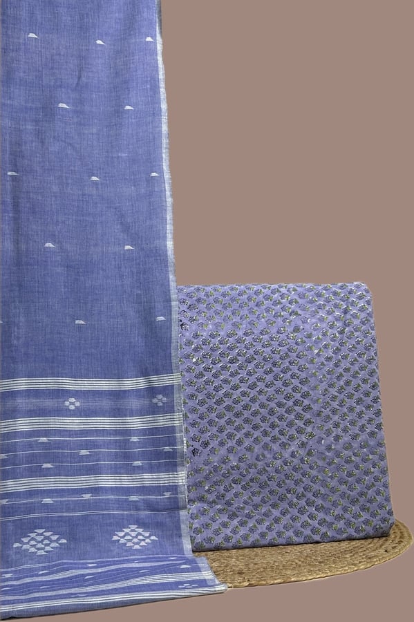 This blue unstitched suit fabric set includes a 2.50 metre Handloom Cotton dupatta paired with a 2.50 metre Blockprint Soft Cotton top fabric. Ideal for custom tailoring into your preferred silhouette.