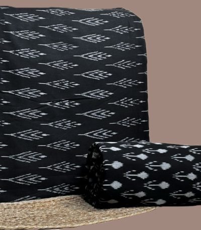 A coordinated black Ikkat pairing — patterned top fabric with a complementary Ikkat bottom in a smaller motif