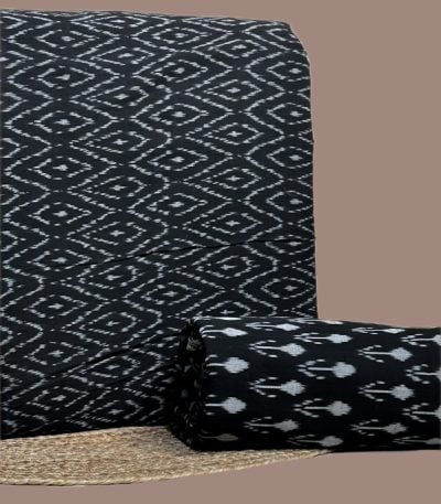 A coordinated black Ikkat pairing — patterned top fabric with a complementary Ikkat bottom in a smaller motif
