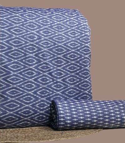 A coordinated blue Ikkat pairing — patterned top fabric with a complementary Ikkat bottom in a smaller motif