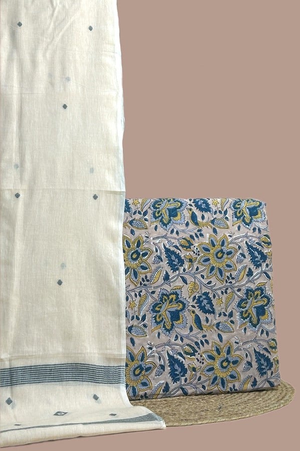 A white set pairing a handwoven Handloom dupatta with a hand blockprinted soft cotton top fabric