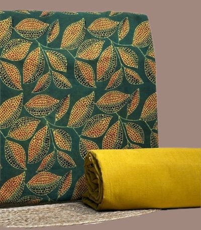 A green Ajrakh top fabric with a hand dyed solid cotton bottom