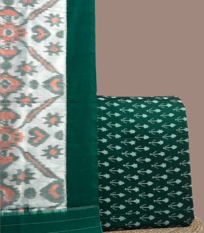 A green handwoven Ikkat set with a patterned dupatta and coordinating Ikkat top fabric
