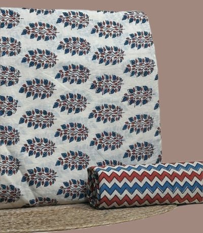 A white Ajrakh set with a printed top fabric and a coordinating Ajrakh bottom in a contrasting motif