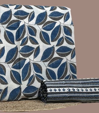 A white Ajrakh set with a printed top fabric and a coordinating Ajrakh bottom in a contrasting motif