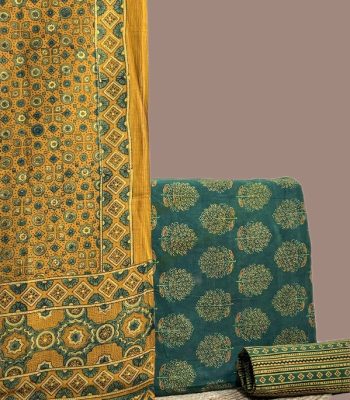 A green three piece Ajrakh set with a bordered printed dupatta