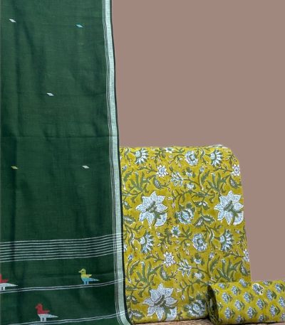 Green jamdani bird motif dupatta with mustard blockprint floral top and matching bottom fabric.