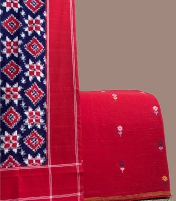 Navy and red patola Ikkat dupatta with a red multi floral jamdani woven top.