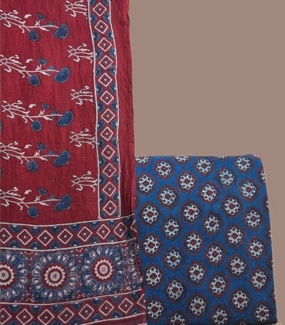 Madder red Ajrakh dupatta with indigo floral sprigs and an indigo Ajrakh medallion top.