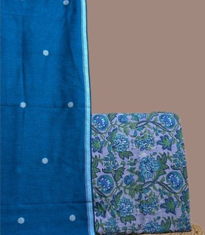 Bright blue handloom jamdani dupatta with a lavender top blockprinted in dense blue florals.