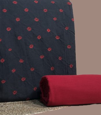 Black bandhani top with madder red tie dyed dots and a plain maroon bottom.