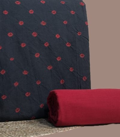 Black bandhani top with madder red tie dyed dots and a plain maroon bottom.