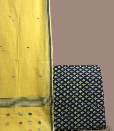 Yellow handloom jamdani dupatta with woven butis and a black floral buti blockprint top.