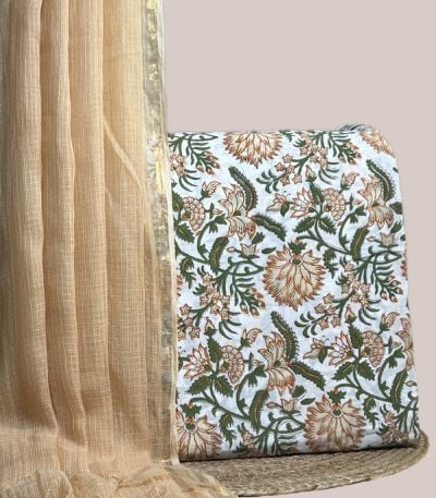 Sheer peach AirLoom Kota dupatta with zari border and an ivory top in rust florals.