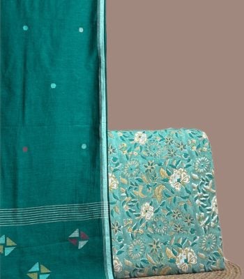 Teal handloom jamdani dupatta with woven pinwheel motifs and an aqua floral blockprint top.