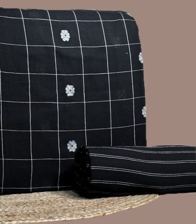 Black handloom check top woven with white floral butis and a black stripes bottom.