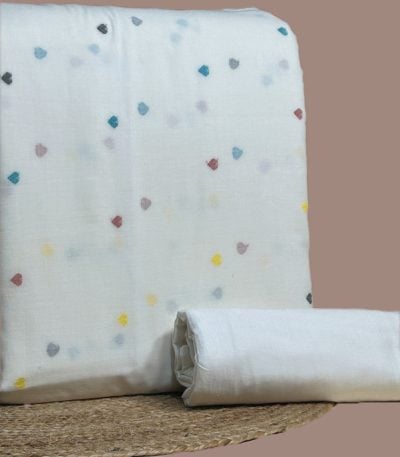 Ivory handloom top woven with scattered multicolour heart butis and a plain kora bottom.