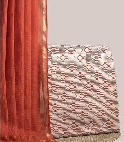 Sheer rust AirLoom Kota dupatta with zari border and an ivory rust geometric top.