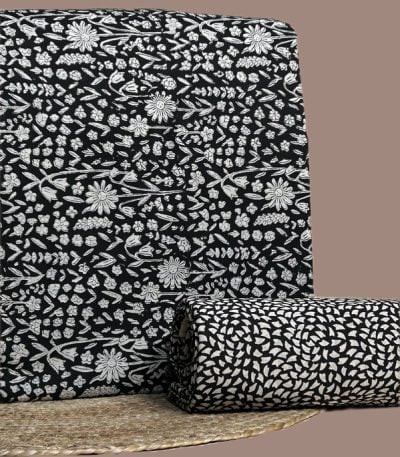 Black and white Bagru floral print top with matching black petal print bottom.