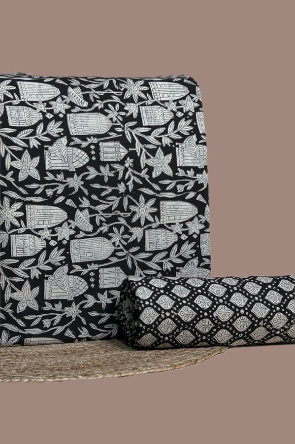 Black and white Bagru birdcage print top with matching black leaf trellis print bottom.