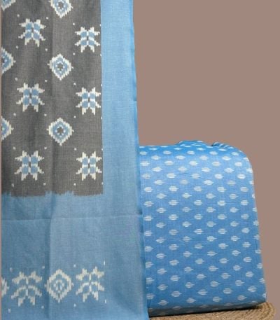 Blue ikkat top paired with gray ikkat dupatta with blue motifs and blue border.