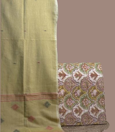 Multicolour jaal blockprint top paired with olive handloom jamdani dupatta.