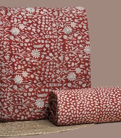 Red Bagru blockprint cotton set with white floral jaal top and petal-print bottom.