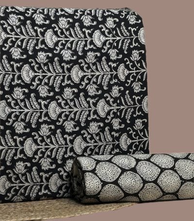 Black Bagru blockprint cotton set with floral sprig top and leaf-drop bottom.