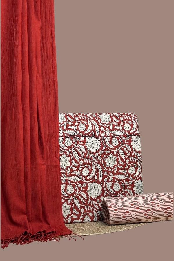 Red cotton handloom dupatta with red floral Bagru blockprint top and striped bottom.