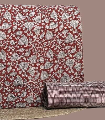 Red Bagru blockprint cotton set with floral vine top and check-print bottom.