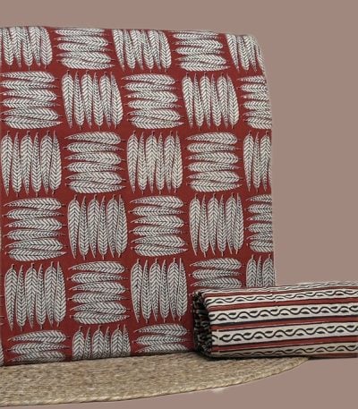 Red Bagru blockprint cotton set with feather motif top and striped border bottom.