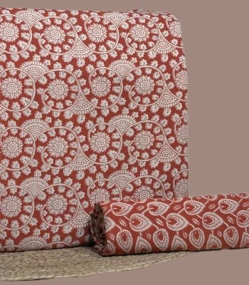 Red Bagru blockprint cotton set with floral swirl top and leaf-drop bottom.