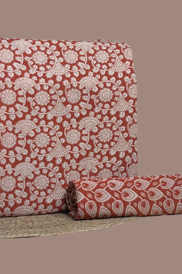 Red Bagru blockprint cotton set with floral swirl top and leaf-drop bottom.