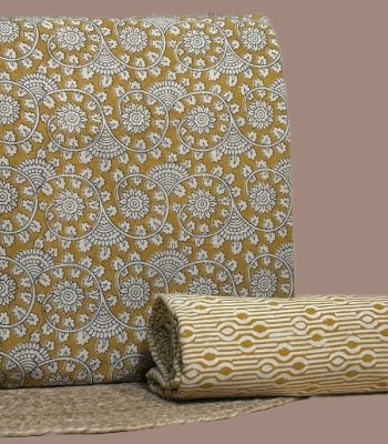 Yellow Bagru blockprint cotton set with floral swirl top and geometric stripe bottom.
